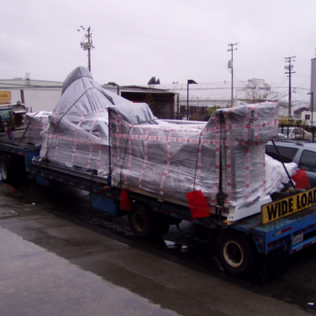 A CNC router on the rigger's flatbed.